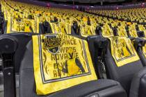 New rally towels await fans on their seat inside before the first period of their NHL opening n ...