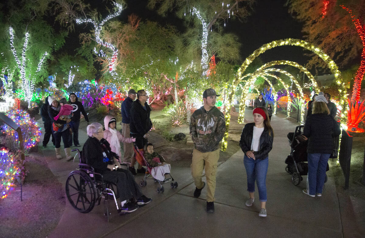 Holiday goers enjoy the lights at Ethel M Chocolates Botanical Cactus Garden on Monday, Novembe ...