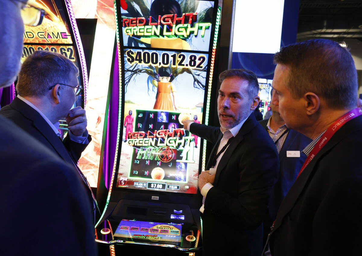 Daniel Grim of Light and Wonder demonstrates how Squid Game is played at Light and Wonder booth ...