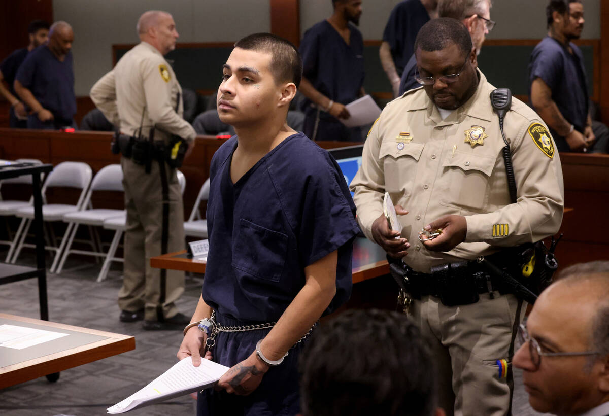 Jesus Ayala, 18, walks out of the courtroom after appearing at the Regional Justice Center in L ...