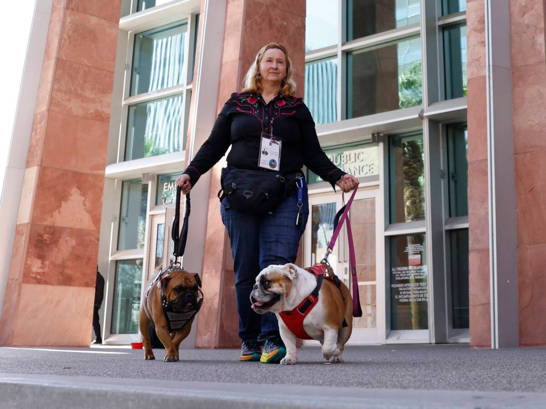 Stephani Loffredo poses for a photo with her therapy dogs, Hufflepuff, left, and Scarlett, walk ...