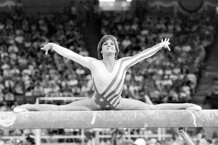 FILE - Mary Lou Retton, of the United States, performs on the balance beam during the women's g ...