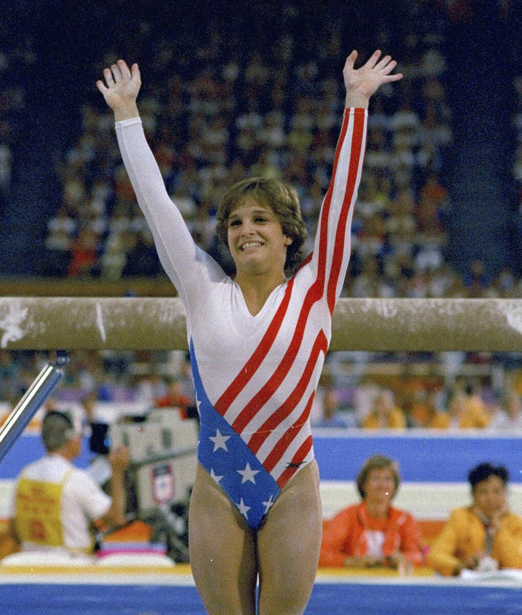 FILE- Mary Lou Retton reacts to applause after her performance at the Summer Olympics in Los A ...