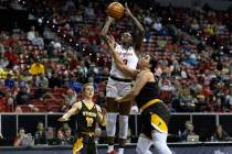 UNLV Lady Rebels center Desi-Rae Young (23) shoots against Wyoming Cowgirls guard Malene Peders ...