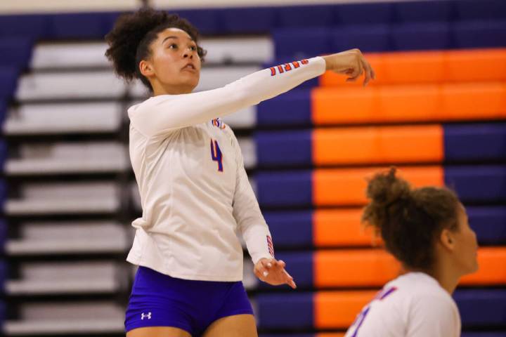 Bishop Gorman’s Ayanna Watson (4) moments after spiking the ball during a volleyball gam ...