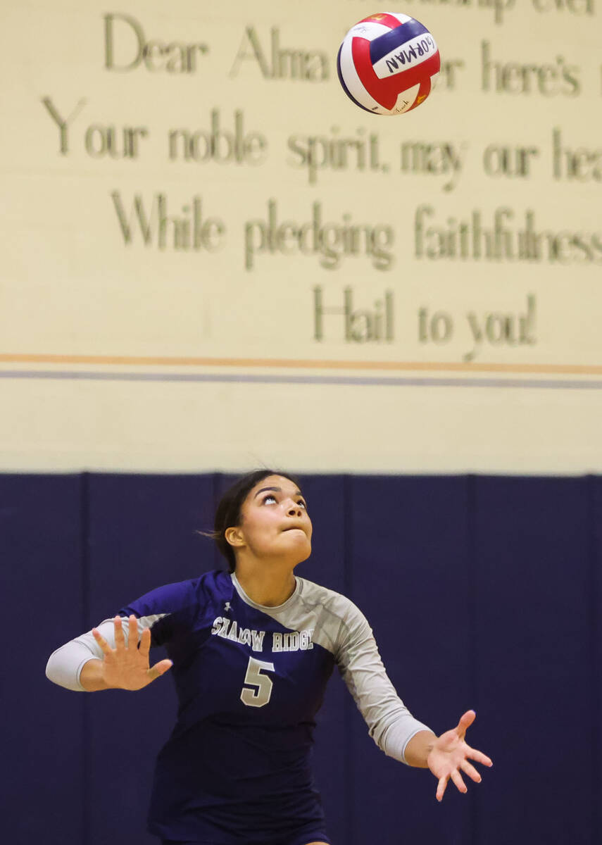 Shadow Ridge outside hitter Desirae Noble (5) sets the ball during a game against Bishop Gorman ...