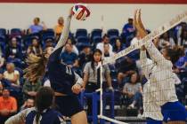Shadow Ride middle blocker Riah Thurston (11) slams the ball over the net during a game against ...