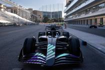 A Formula One show car is transported from the F1 Pit Building after a news conference on Tuesd ...