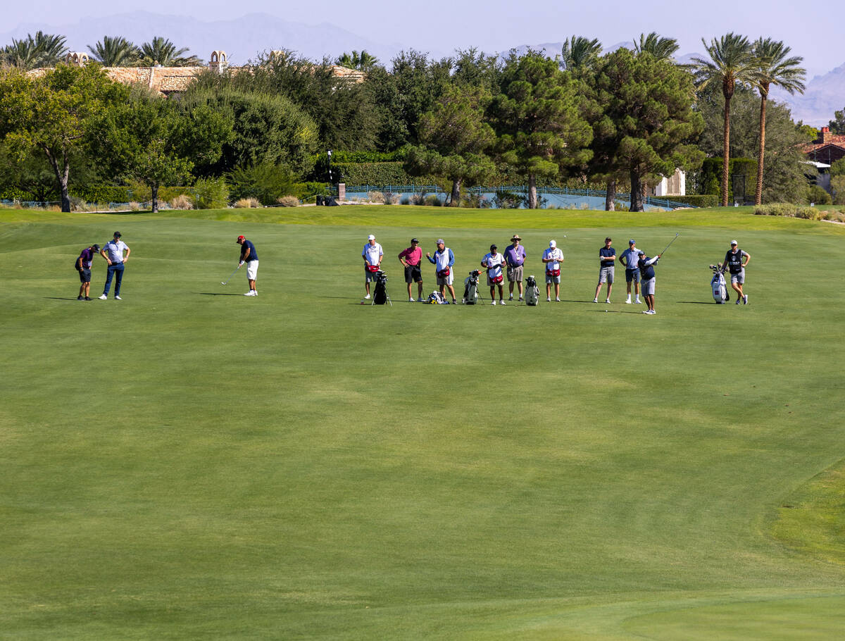 Golfers play along the fairway on hole 18 during the Pro Am before the Shriners Children's Open ...