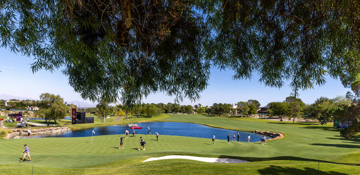 Golfers approach the green at hole 16 during the Pro Am before the Shriners Children's Open fro ...