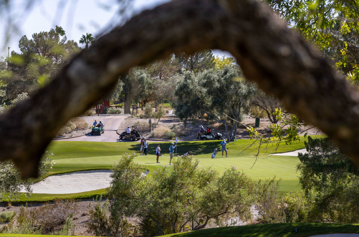 Golfers play on the green on hole 3 during the Pro Am before the Shriners Children's Open from ...