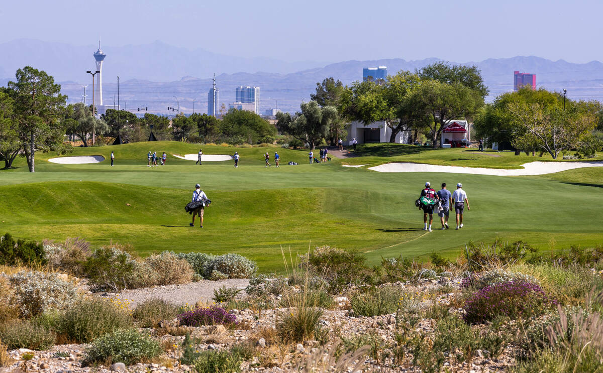 Golfers walk up the fairway at hole 4 during the Pro Am before the Shriners Children's Open fro ...