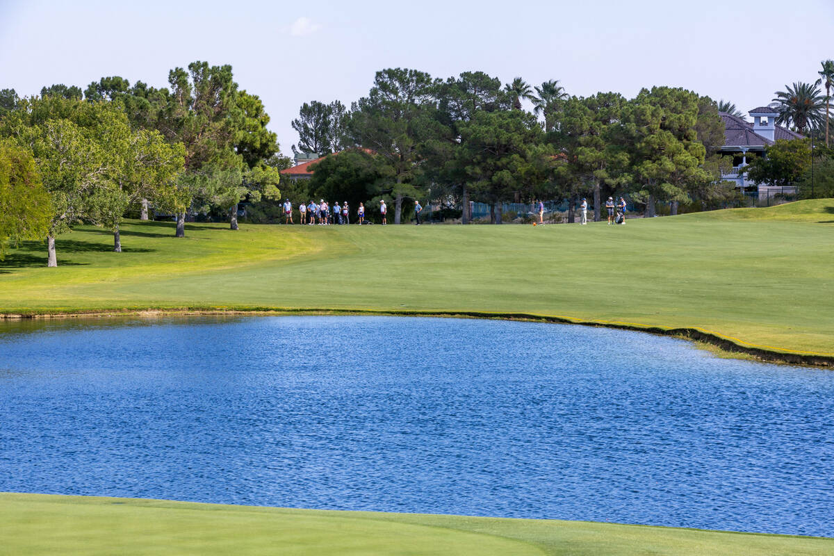 Golfers hit balls up the fairway at hole 16 during the Pro Am before the Shriners Children's Op ...