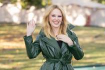 Kylie Minogue poses for photographers upon arrival at the Burberry Spring Summer 2024 fashion s ...