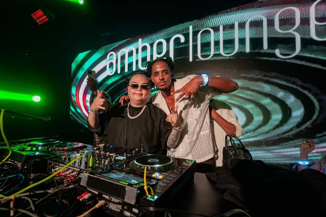 DJ Buddha, left and Cordell Broadus, son of rap icon Snoop Dogg, are shown at Amber Lounge's Si ...