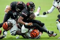 Arizona Cardinals quarterback Joshua Dobbs gets tackled against the Cincinnati Bengals during t ...