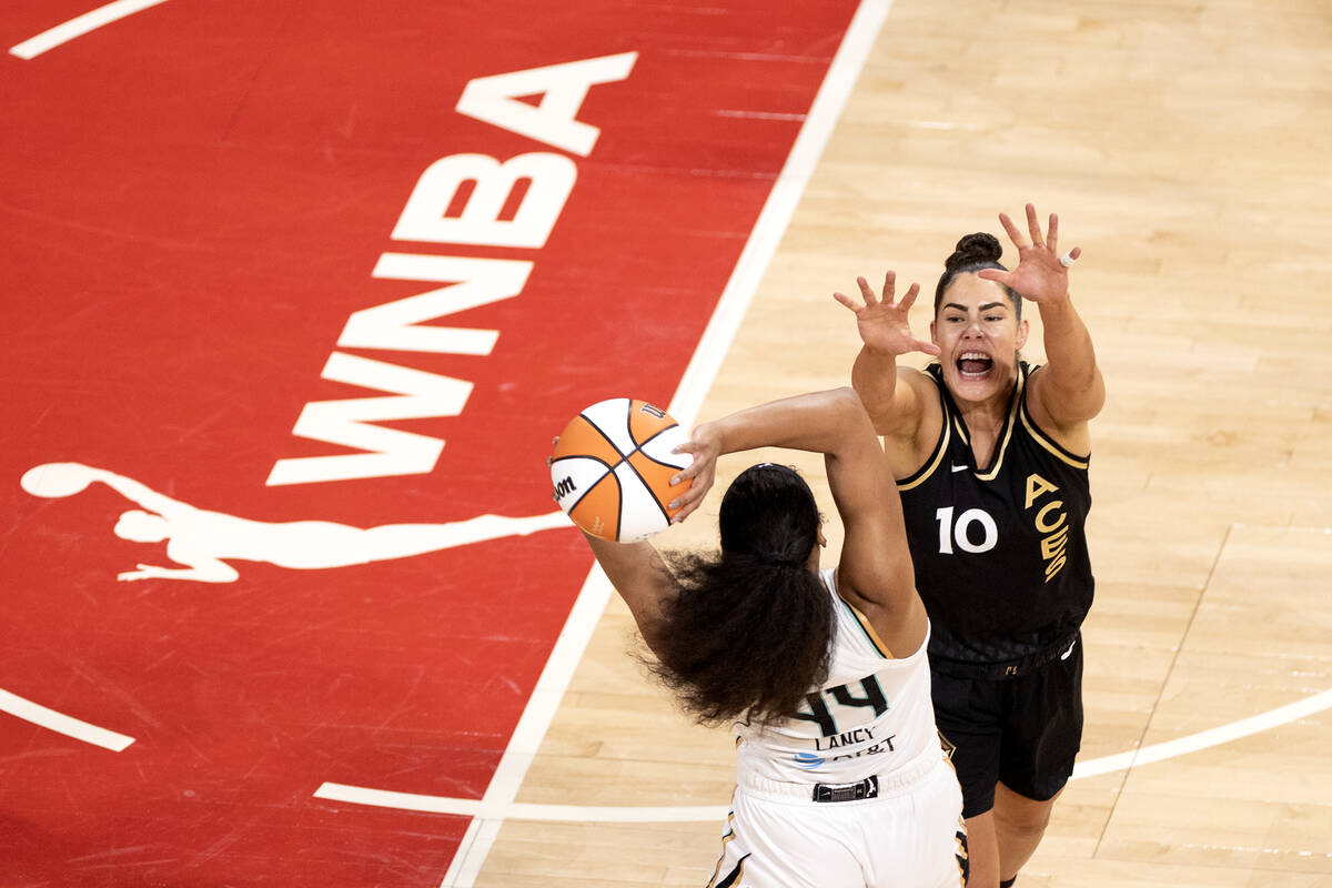 Las Vegas Aces guard Kelsey Plum (10) defends against New York Liberty forward Betnijah Laney ( ...