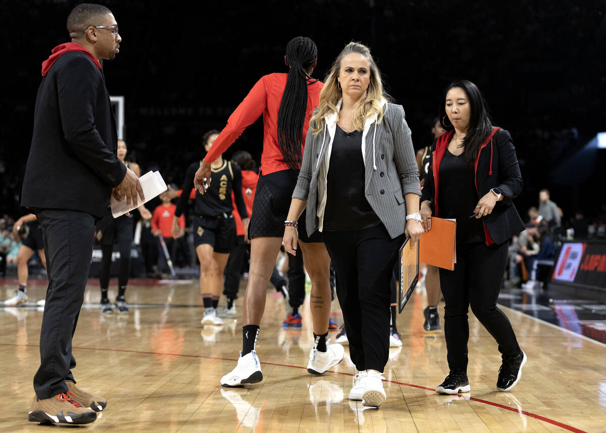 Las Vegas Aces head coach Becky Hammon brings her team in for a timeout during the first half i ...