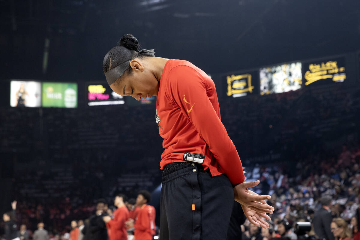 Las Vegas Aces forward A'ja Wilson (22) prays before Game 2 of a WNBA basketball final series a ...
