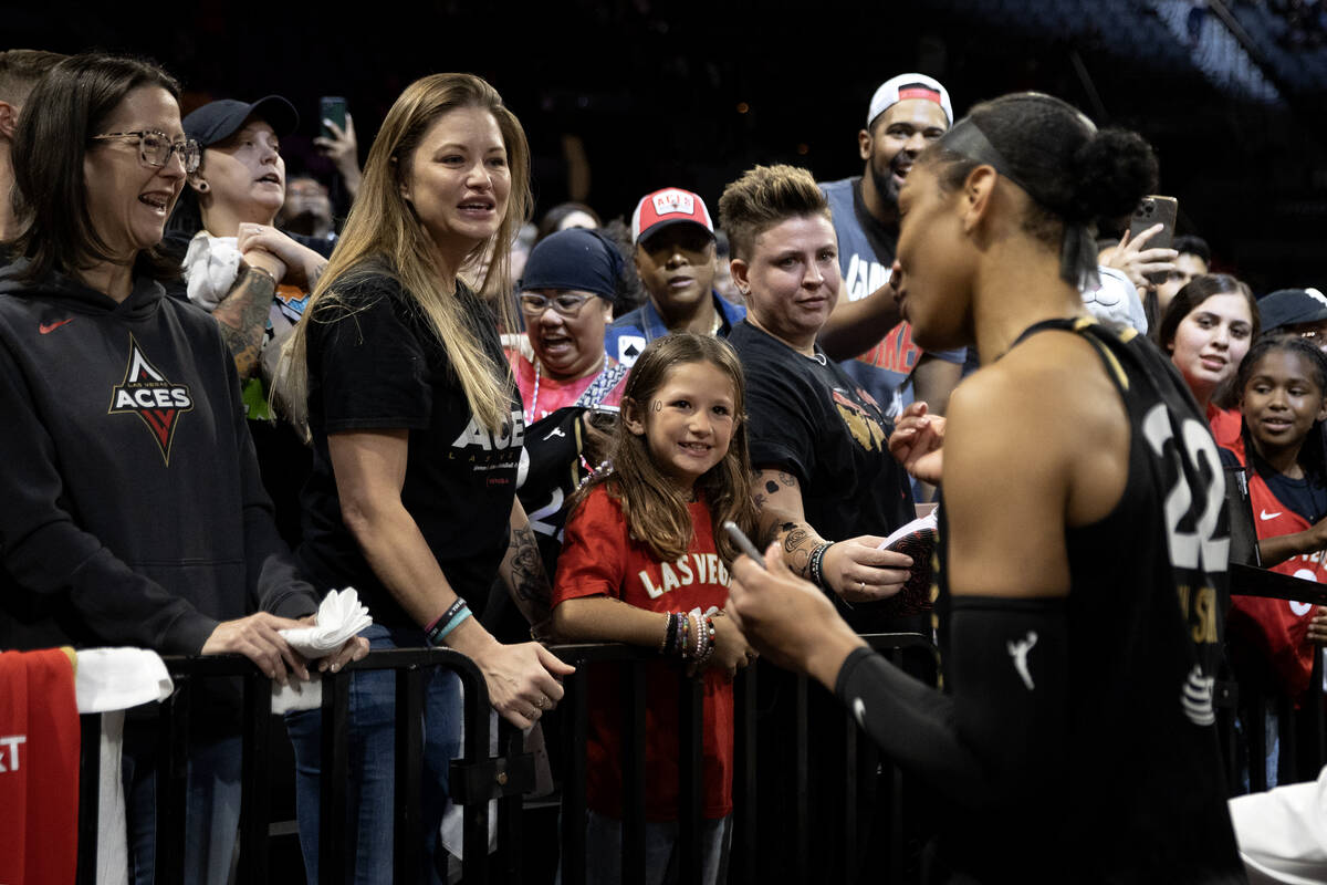 Las Vegas Aces fans get autographs signed by Aces star forward A'ja Wilson after Game 2 of a WN ...