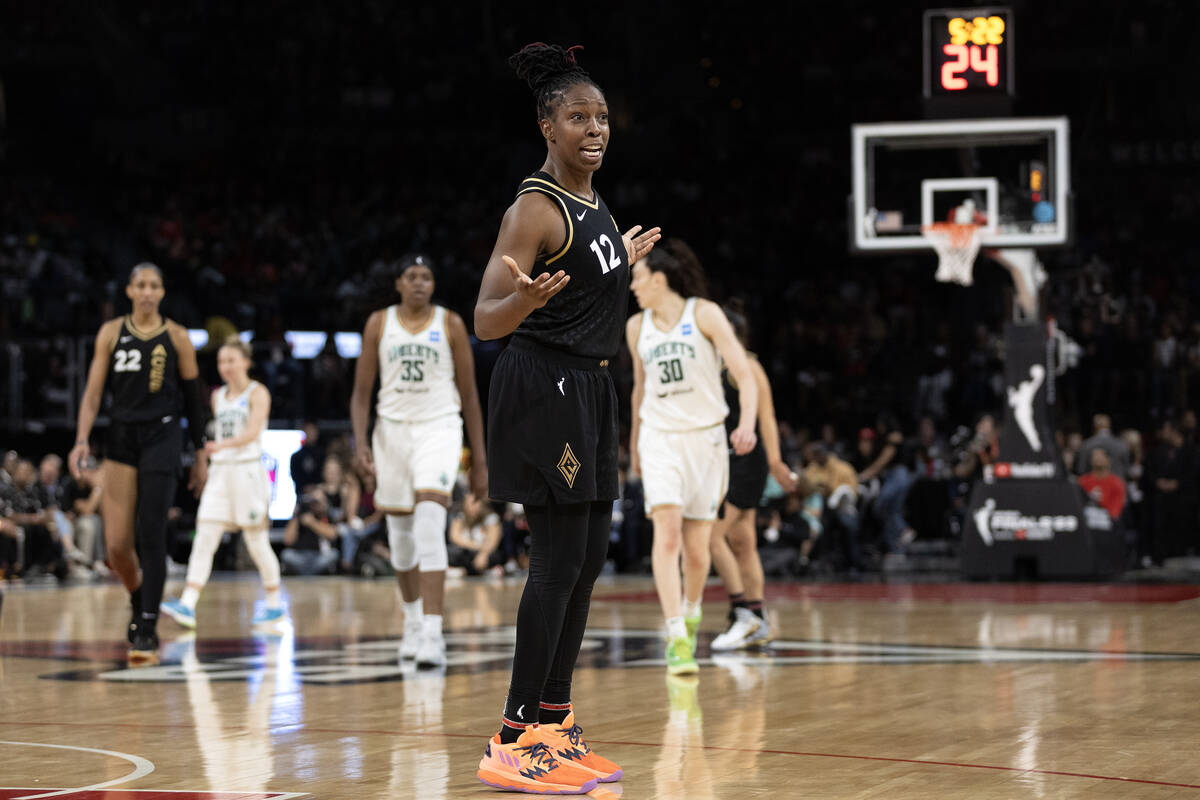 Las Vegas Aces guard Chelsea Gray (12) gestures to the bench in confusion after referees called ...
