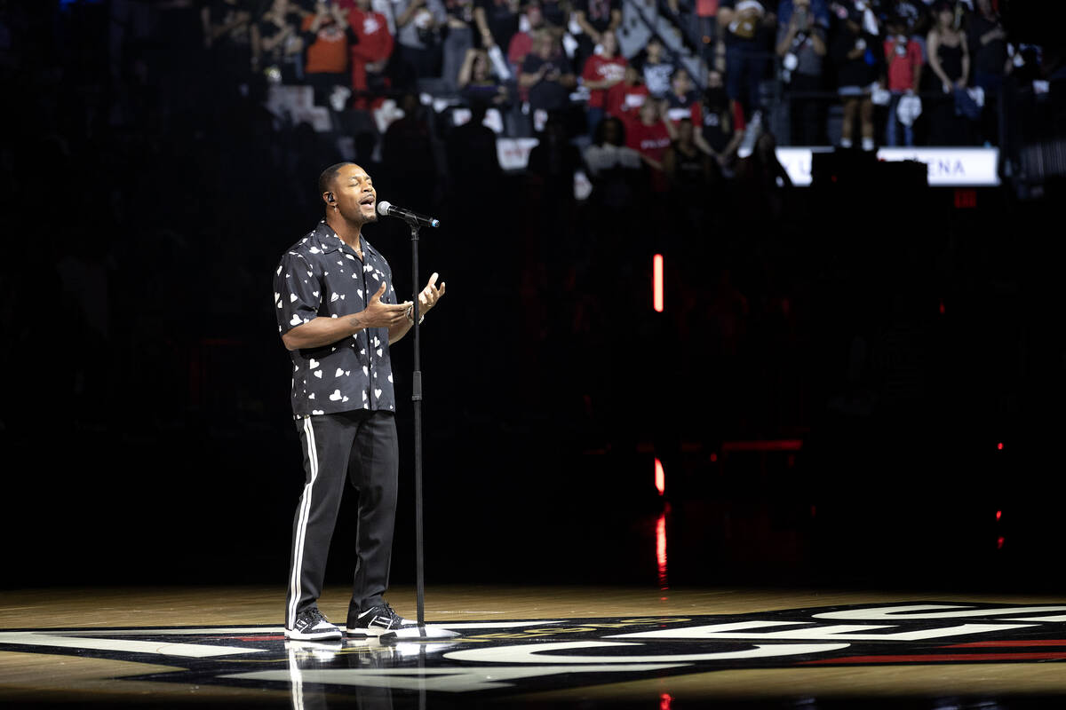 R&B musician Tank performs the national anthem before Game 2 of a WNBA basketball final ser ...