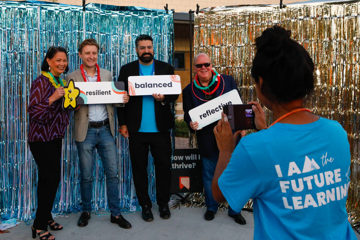Jhone Ebert, from left, Alex Bybee, Sean Parker, and Ken Turner pose at a photo booth as the Ne ...