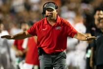 UNLV coach Barry Odom gestures from the sidelines during an NCAA college football game against ...