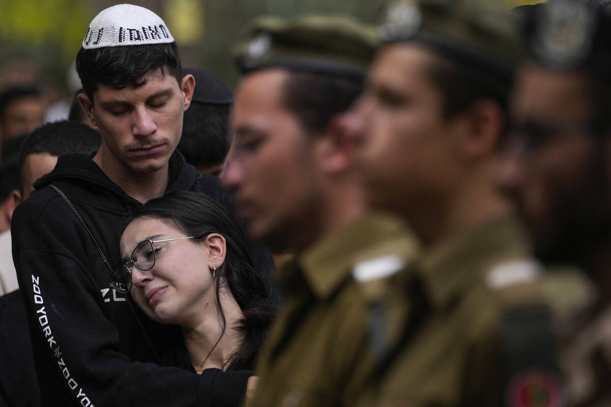 Mourners attend the funeral of Israeli soldier Abraham Cohen at the Mount Herzl cemetery in Jer ...
