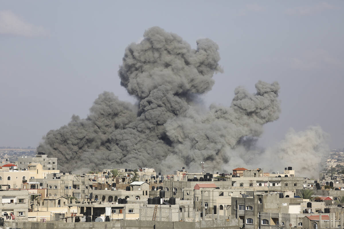 Smoke rises following Israeli airstrikes in Rafah, southern Gaza Strip on Thursday, Oct. 12, 20 ...