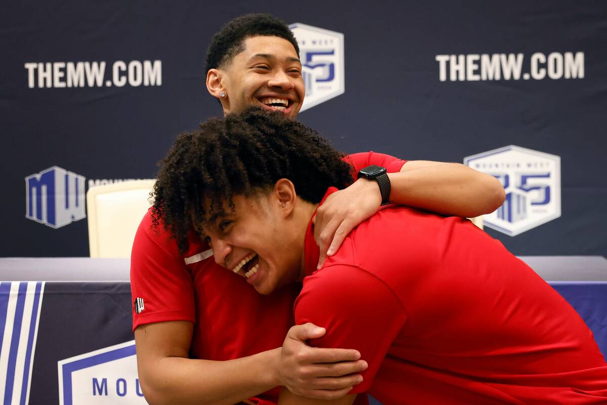 UNLV Rebels guard Justin Webster, left, and forward Jalen Hill jokingly wrestle before addressi ...