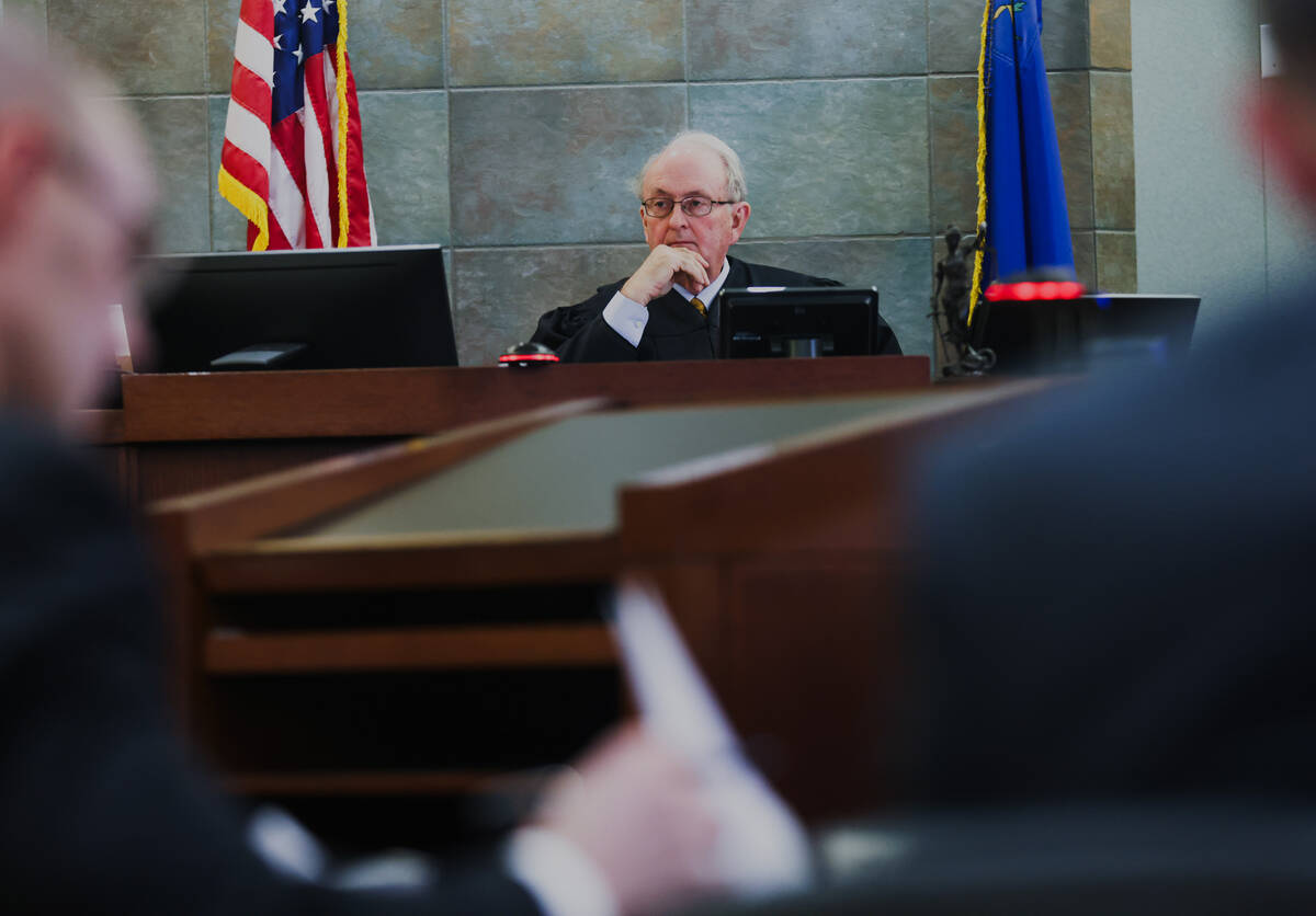 Clark County District Court Judge Mark Denton oversees a hearing regarding the Nevada Associati ...