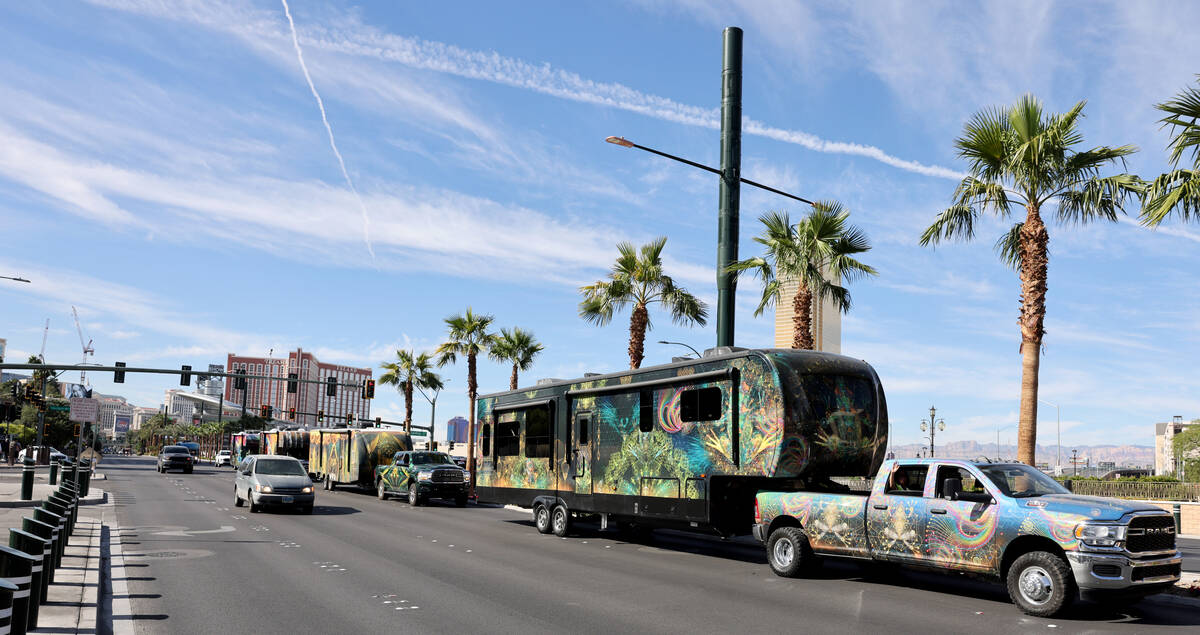 Members of Frooogs Camp make their way up the Strip near Convention Center Drive in Las Vegas d ...