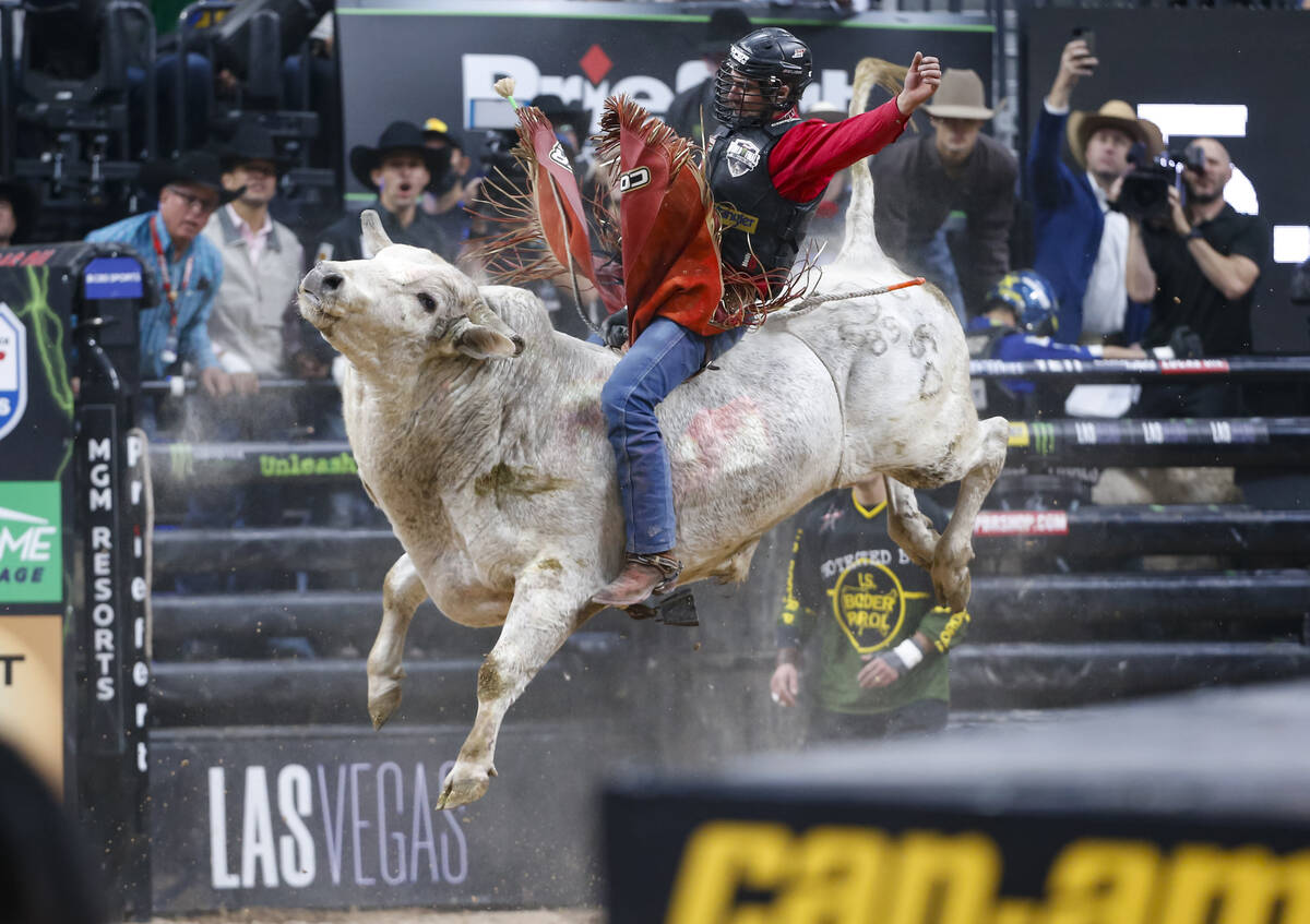 Silvano Alves rides Moonlight PartyӠ in the championship round of the Professional Bull Riders ...