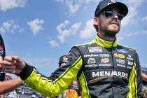 Ryan Blaney walks and greets fans during introductions before a NASCAR Cup Series auto race at ...