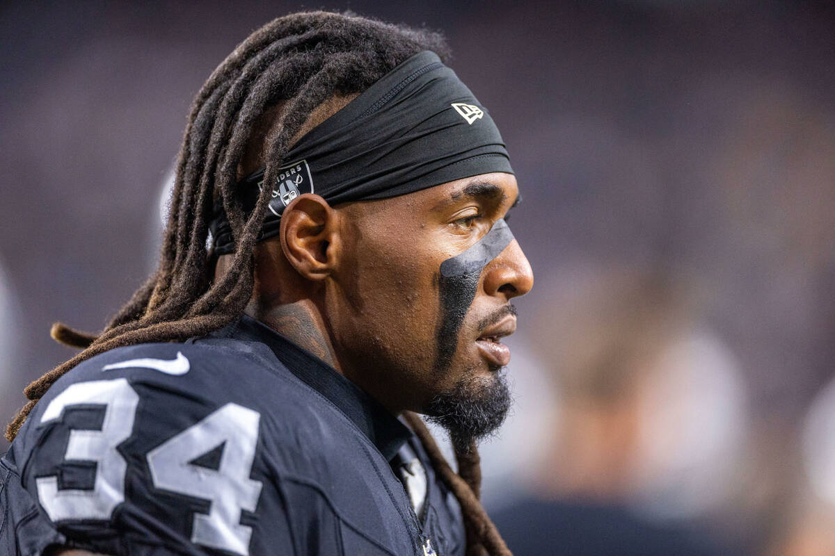 Raiders running back Brandon Bolden (34) paces the sidelines before facing the Green Bay Packer ...