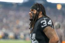 Raiders running back Brandon Bolden (34) looks on from the sideline during the second half an N ...