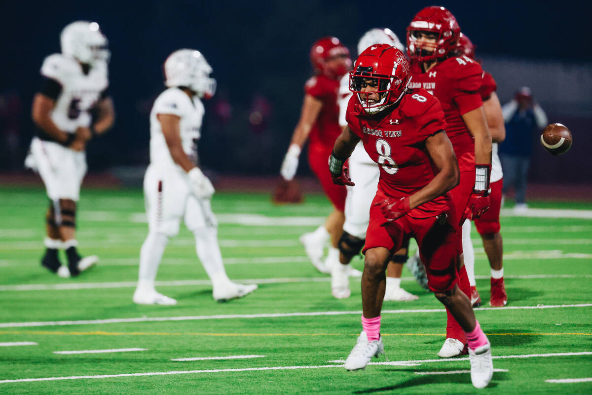 Arbor View strong safety Jahmali Brown (8) celebrates an interception during a game against Lib ...