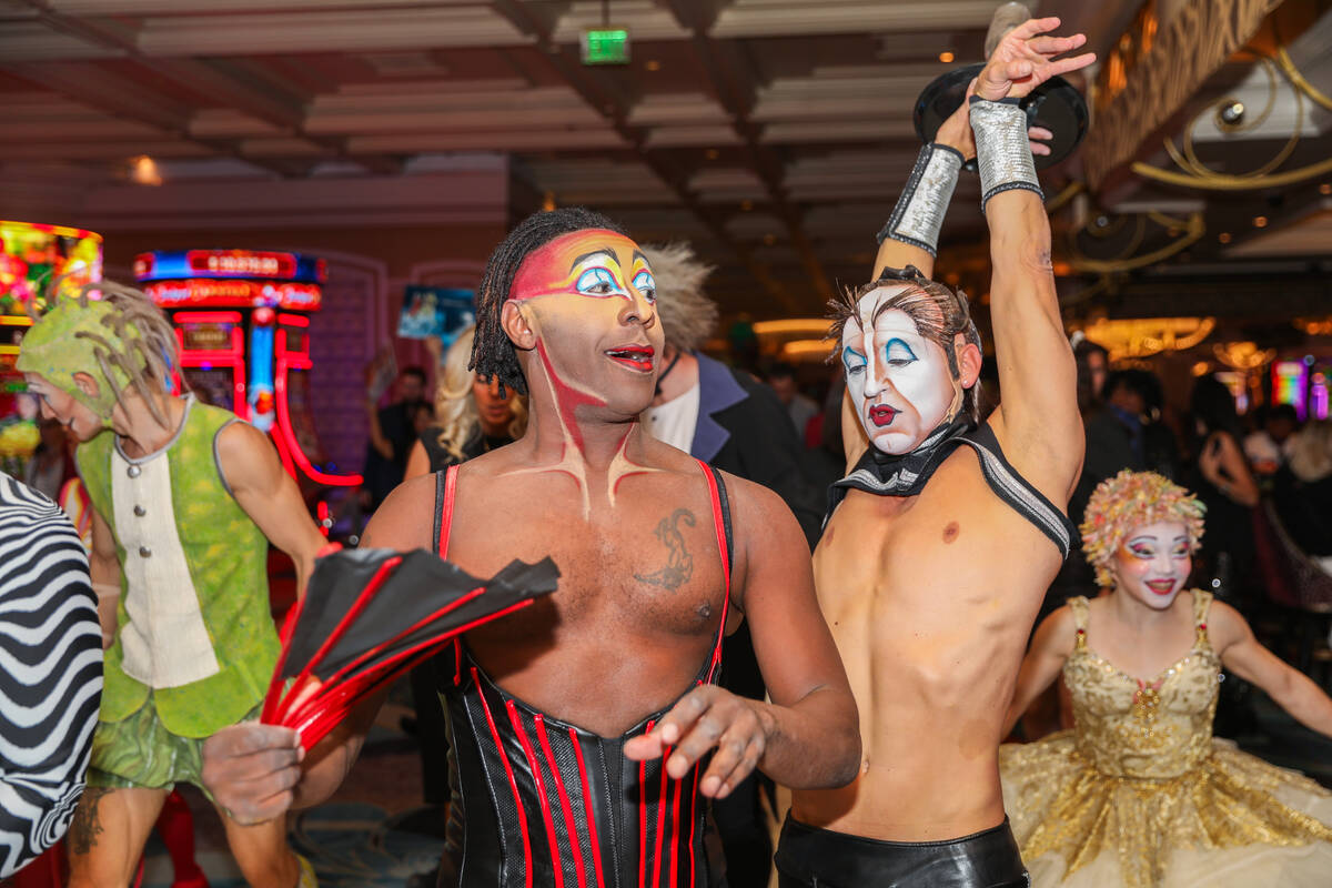 Cirque du Soleil performers walk through the Bellagio as part of the “O” annivers ...