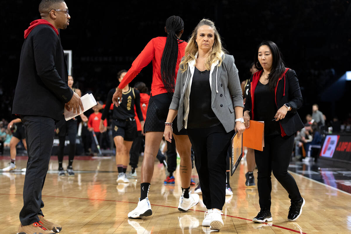 Las Vegas Aces head coach Becky Hammon brings her team in for a timeout during the first half i ...