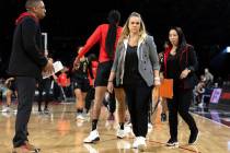 Las Vegas Aces head coach Becky Hammon brings her team in for a timeout during the first half i ...