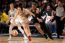 New York Liberty forward Breanna Stewart (30) struggles around Las Vegas Aces forward A'ja Wils ...