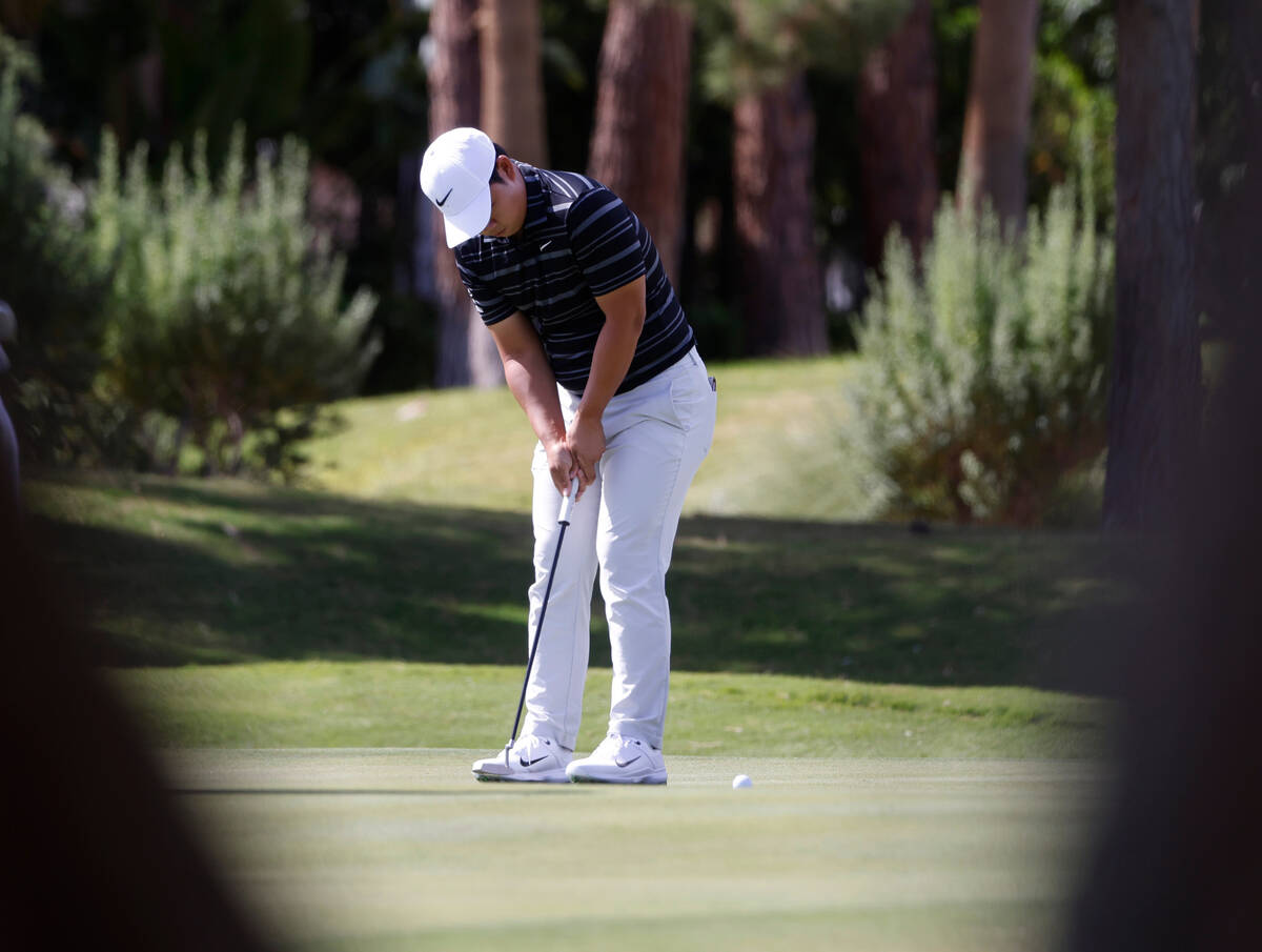 Tom Kim watches his putt on the seventh green during the Shriners Children’s Open tourna ...