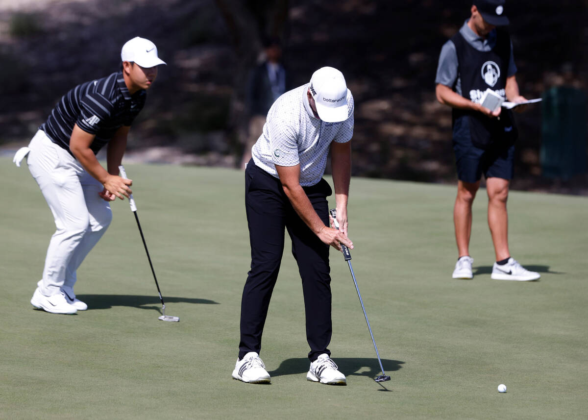 Luke List watches his putt on the seventh as Tom Kim, left, looks on during the Shriners Childr ...