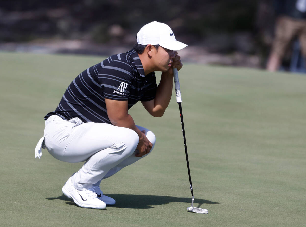 Tom Kim surveys the green on the seventh green during the Shriners Children’s Open tourn ...