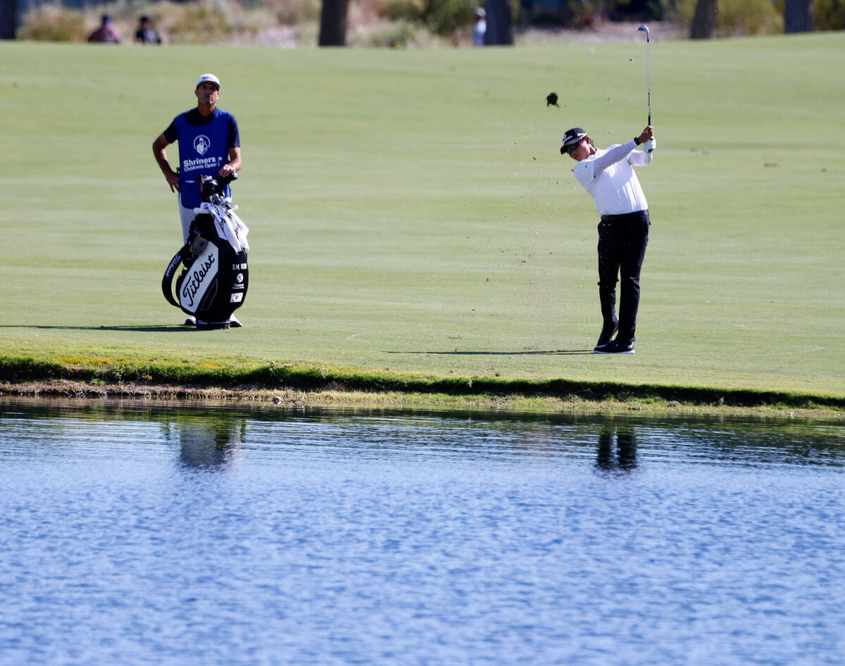 S.H.Kim watches his drive to the 18th green during the Shriners Children’s Open tourname ...