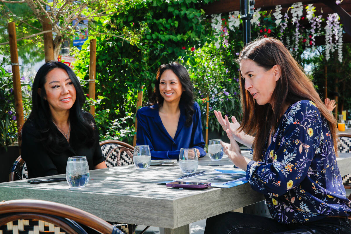 Weina Zhang, CEO and founder of Z Life, from left, Ranielle Rivera, condo sales representative, ...