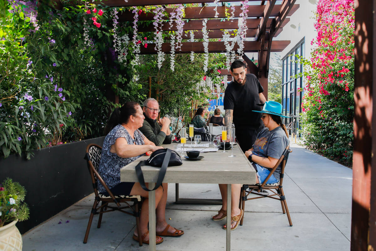 Joane and John Anderson, left, and Katie Anderson, from Minnesota, enjoy a breakfast at The Pep ...