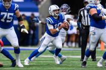 Indianapolis Colts quarterback Gardner Minshew (10) scrambles away from pressure during an NFL ...