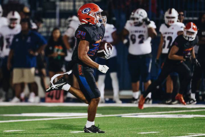 Bishop Gorman running back Myles Norman (24) carries the ball to the end zone during a game aga ...